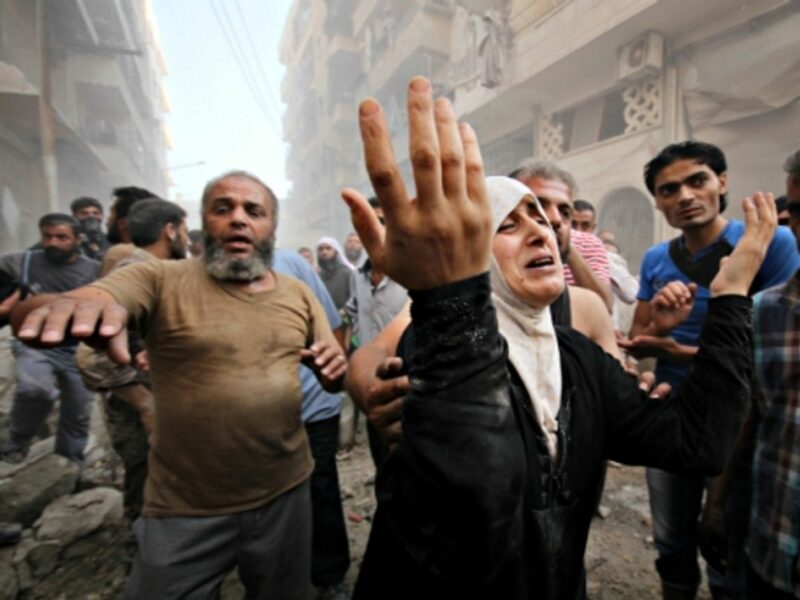 Syrians in Aleppo after airstrikes on Sept. 20