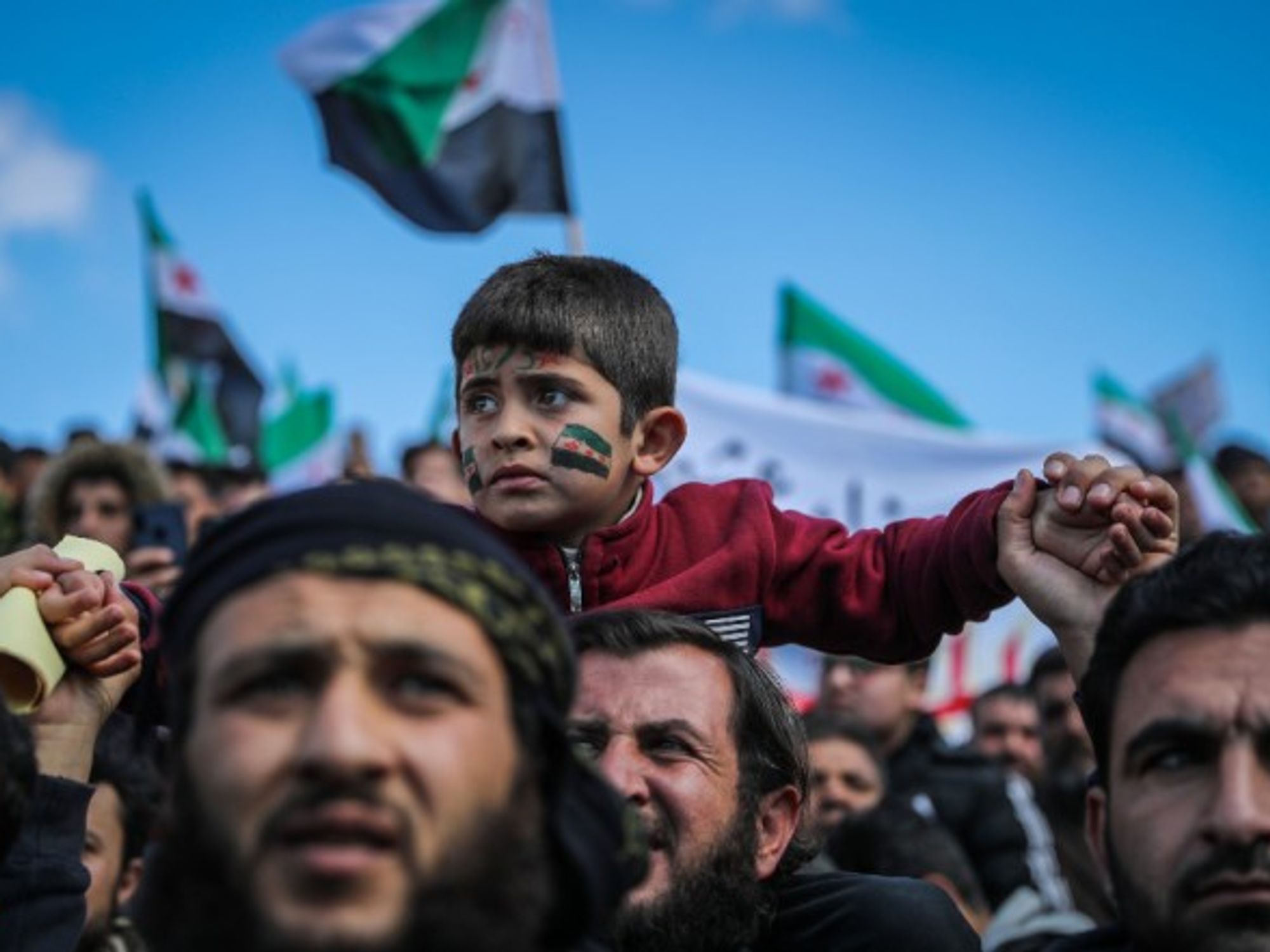 Syrians in the city of Idlib celebrate the 10th anniversary of the Syrian revolution against the regime of leader Bashar al-Assad.