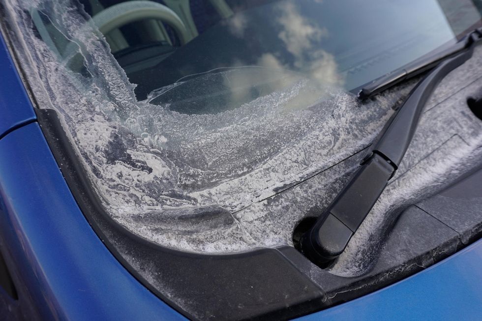 Tailings dust, commonly known as “white dust” in Mongolia, builds up on a car's surface during the windy season in Erdenet.