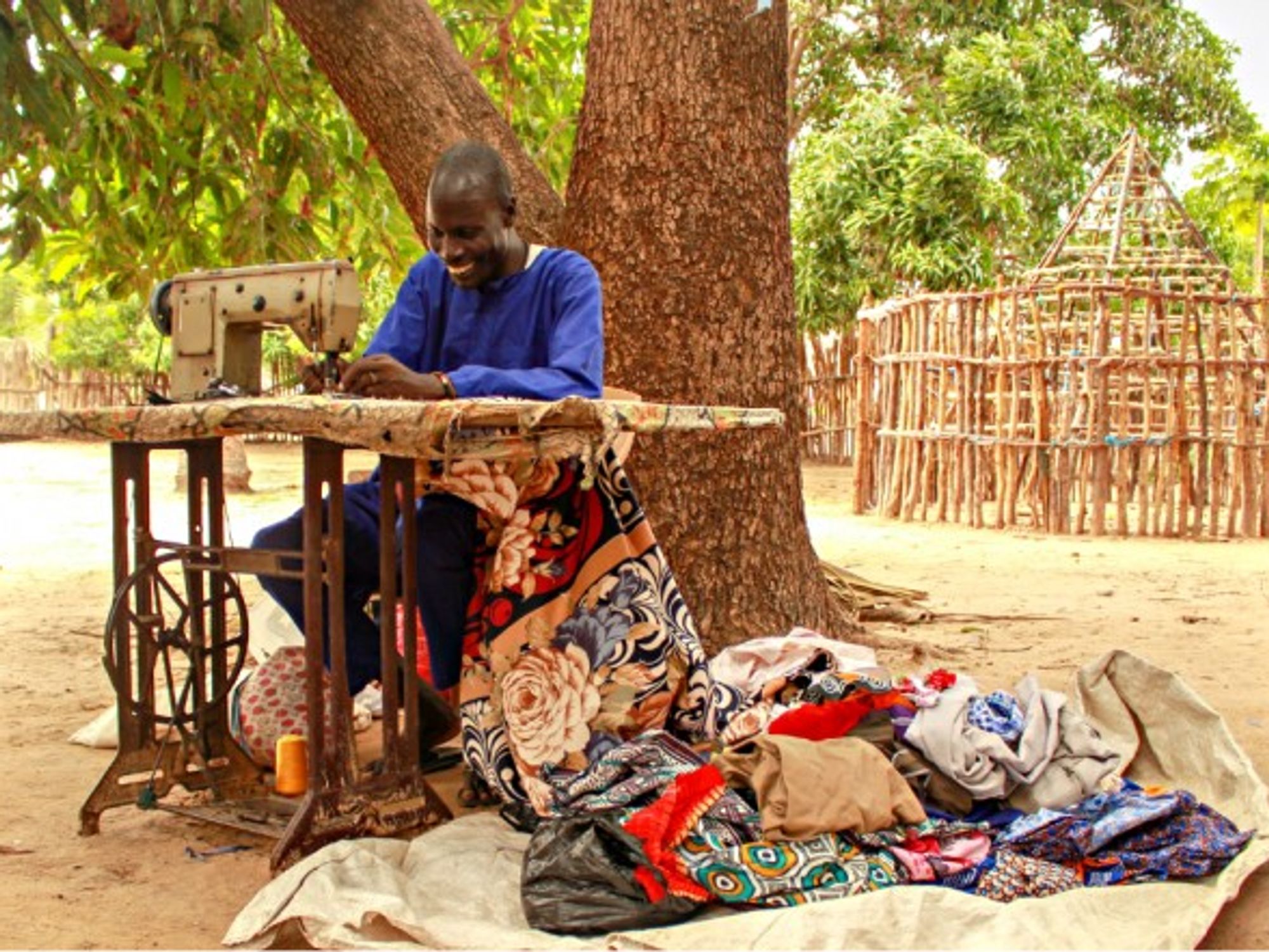 Tailor Peter Koang and his sewing machine in Nyal