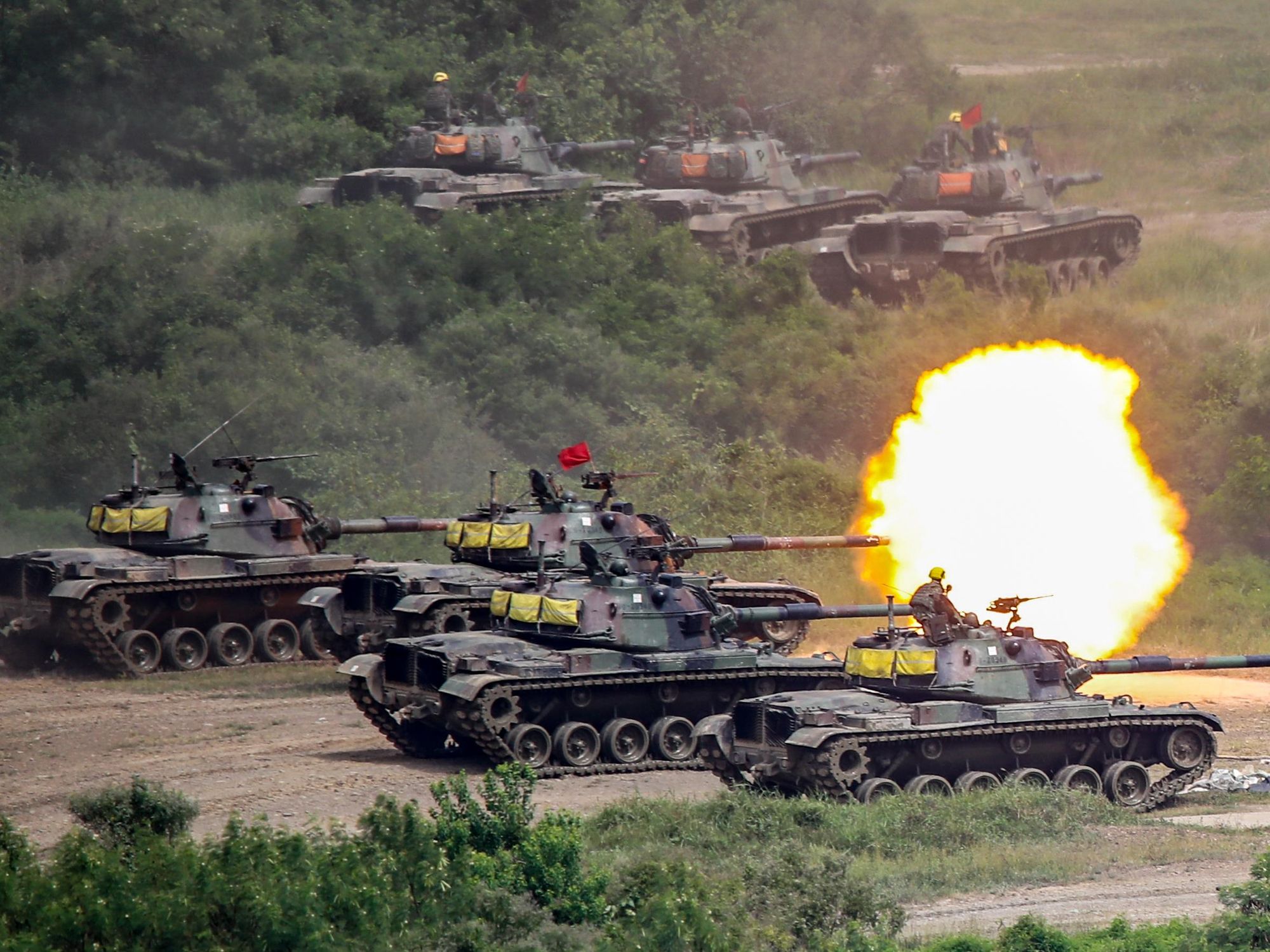Taiwanese tanks fire cannons during a live-fire drill in Pingtung county, Taiwan, on Sept. 7 2022.