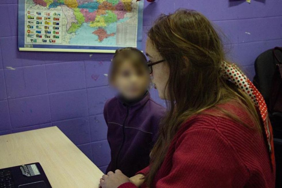 Teacher giving classes from bomb shelter