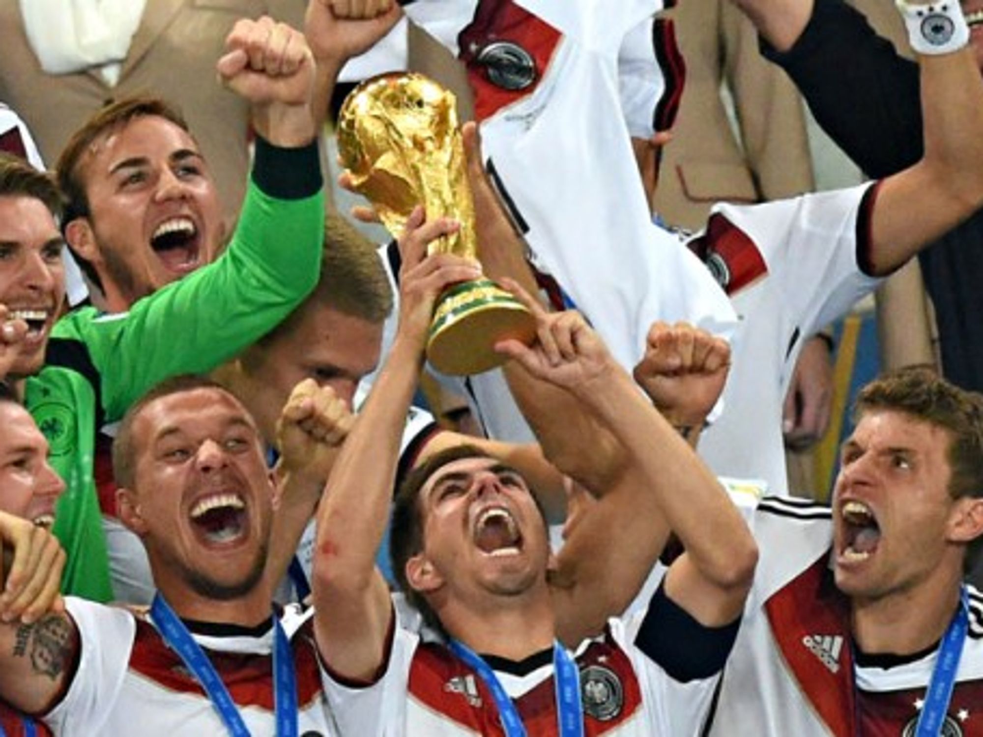 Team captain Philipp Lahm lifts up the World Cup trophy after winning the FIFA World Cup 2014 final soccer game.