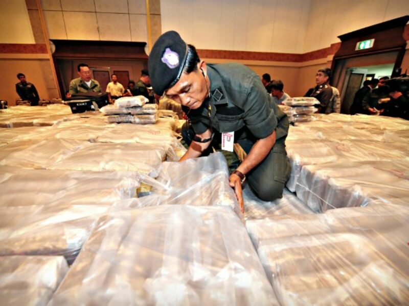 Thai police officer and seized drugs at the police HQ in Bangkok
