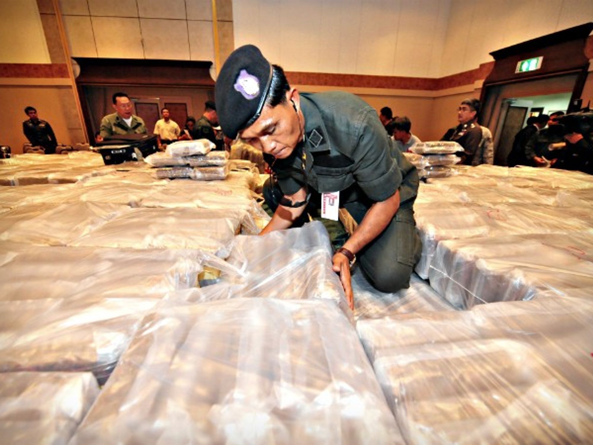 Thai police officer and seized drugs at the police HQ in Bangkok