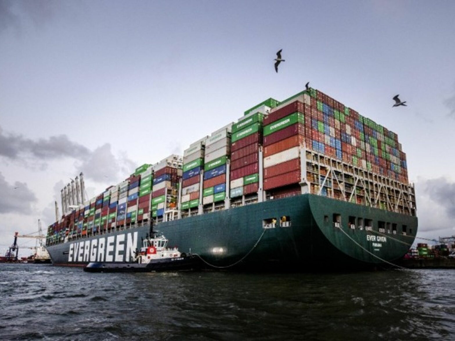 The container ship Ever Given arrives at the ECT Delta terminal in the port of Rotterdam, more than four months after it got wedged in the Suez Canal for six days, blocking shipping in one of the world's busiest waterways