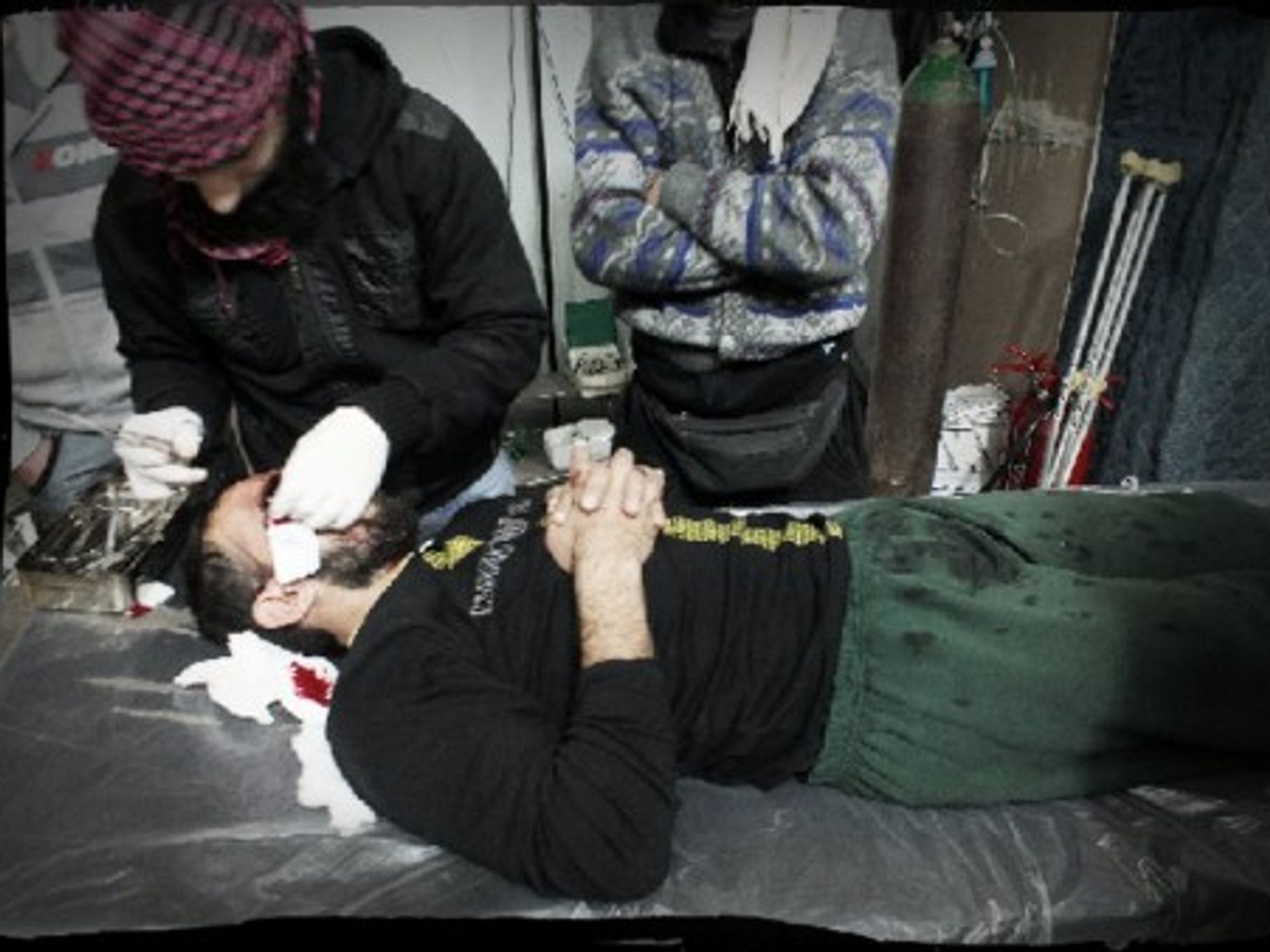 The dark, damp emergency room in the field hospital of besieged Homs