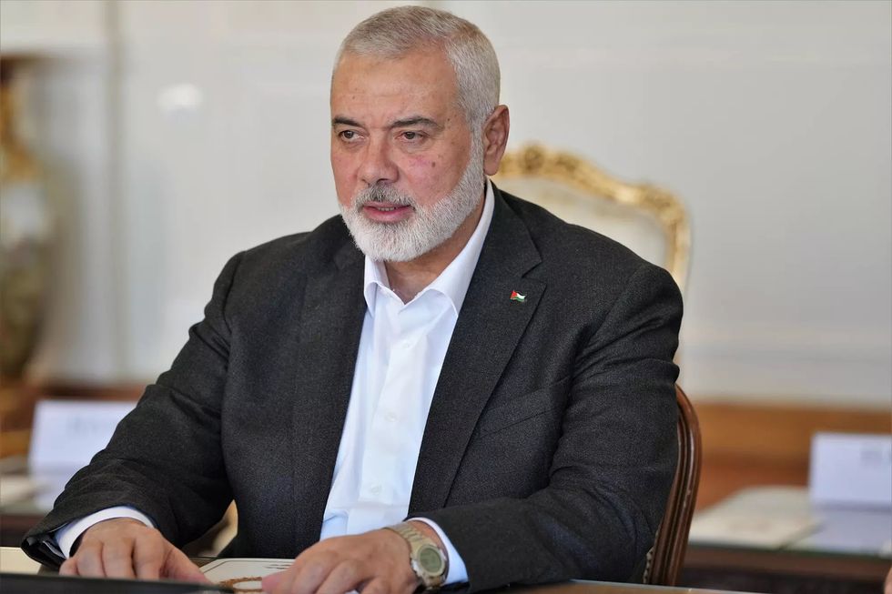 The Doha-based political bureau chief of the Palestinian Islamist movement Hamas ISMAIL HANIYEH meets the Iranian Foreign Minister (unseen) in Tehran.