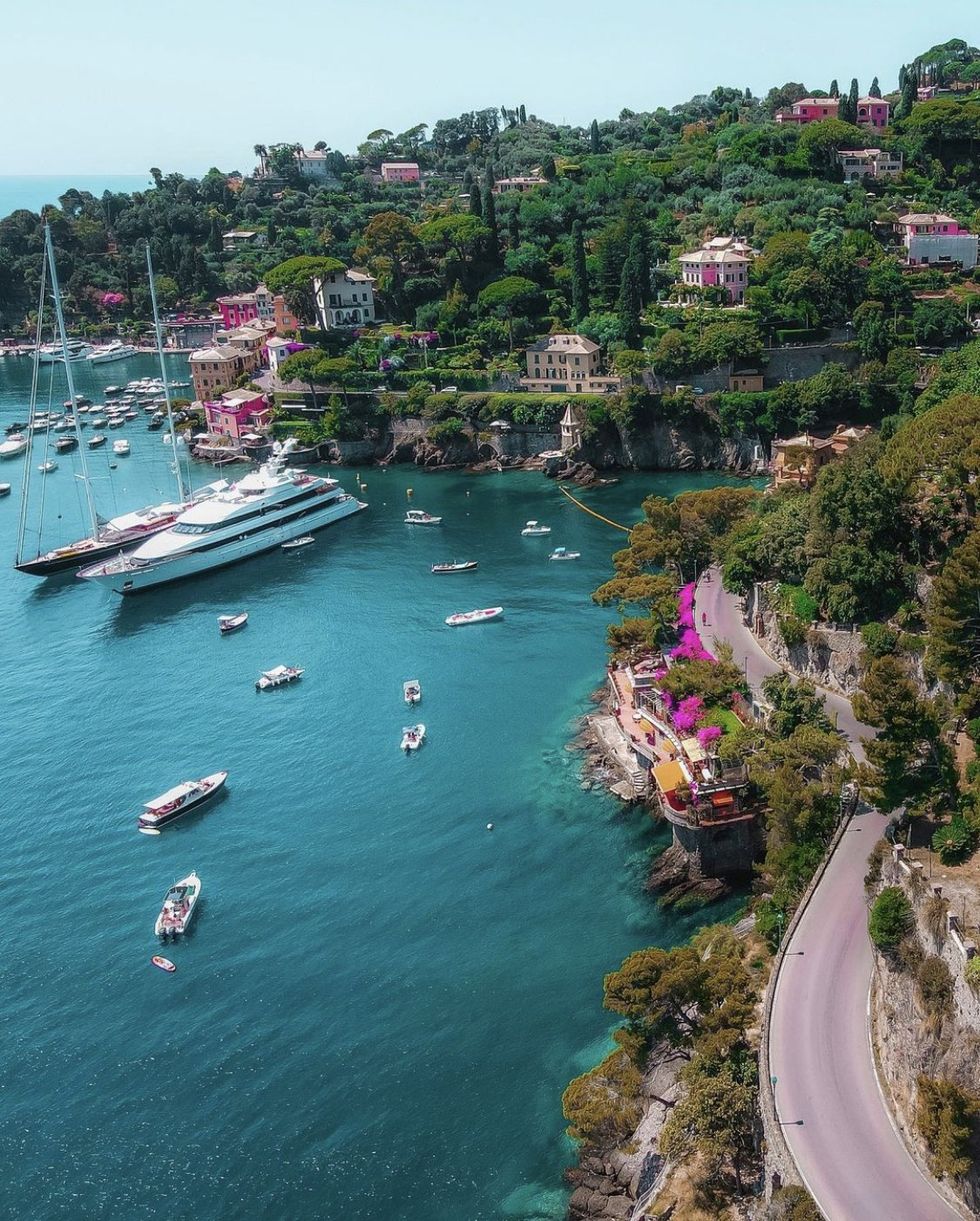 The green coasts meet blue waters on the Portofino coast in Italy.