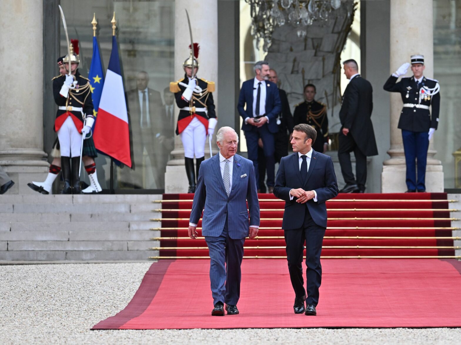 The King and Queen State visit to France-Day One. King Charles III and Emmanuel Macron walk to Elysee Palace.