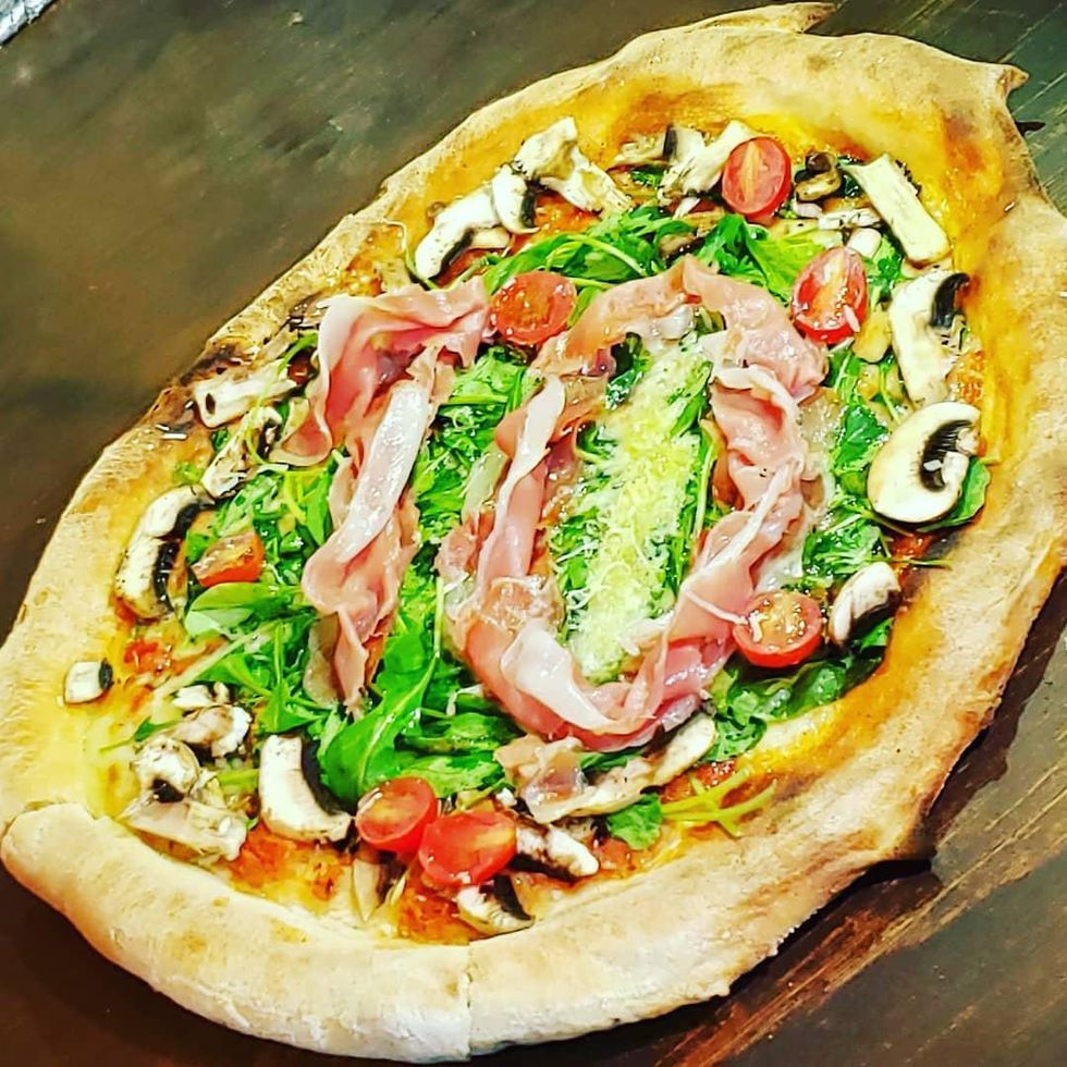 The Maradona pizza is crowned with a slice of ham in the shape of a 10