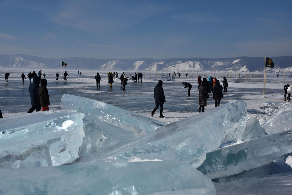 The meter-thick ice of Lake Baikal attracts many tourists in winter