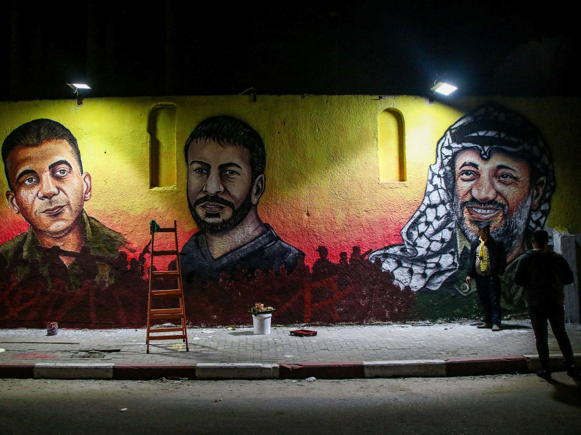 The mural depicts big images of Fatah's leader Yasser Arafat, of Palestinian Nasser Abu Hamid and of Palestinian Zakaria Al-Zubaidi.