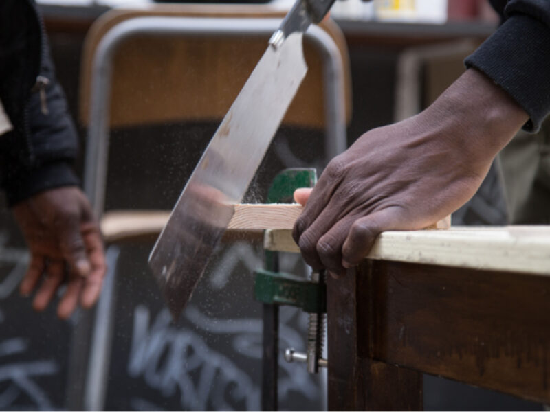 The non-profit organization ''ALI - Free Home Reception'' is hosted by some young migrants from the K_Alma Social Carpentry workshop to build wooden houses and wooden objects.