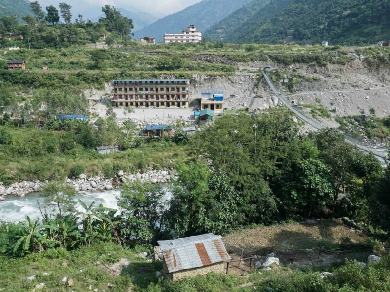 The office that coordinates work on the Nalgad hydroelectric power project is situated atop a hillside (white building) in the Nalgad municipality of Jajarkot district in Karnali province.