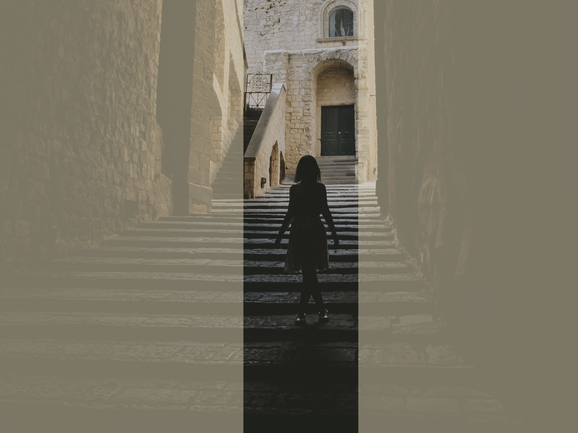 The silhouette of a little girl going down the stairs at a historical monument in Naples.
