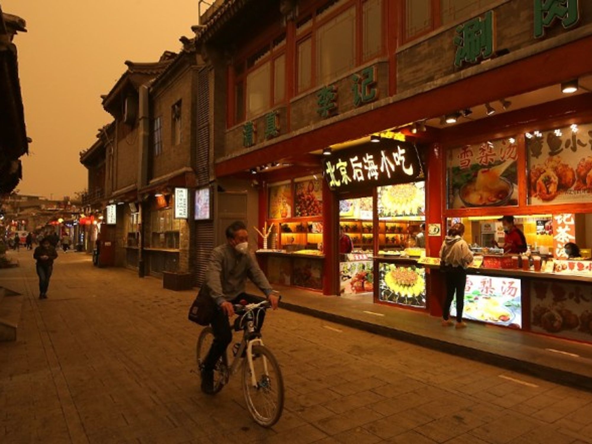 The skies above Beijing turn a dark yellow as China’s capital city is hit by a third major sandstorm in five weeks.