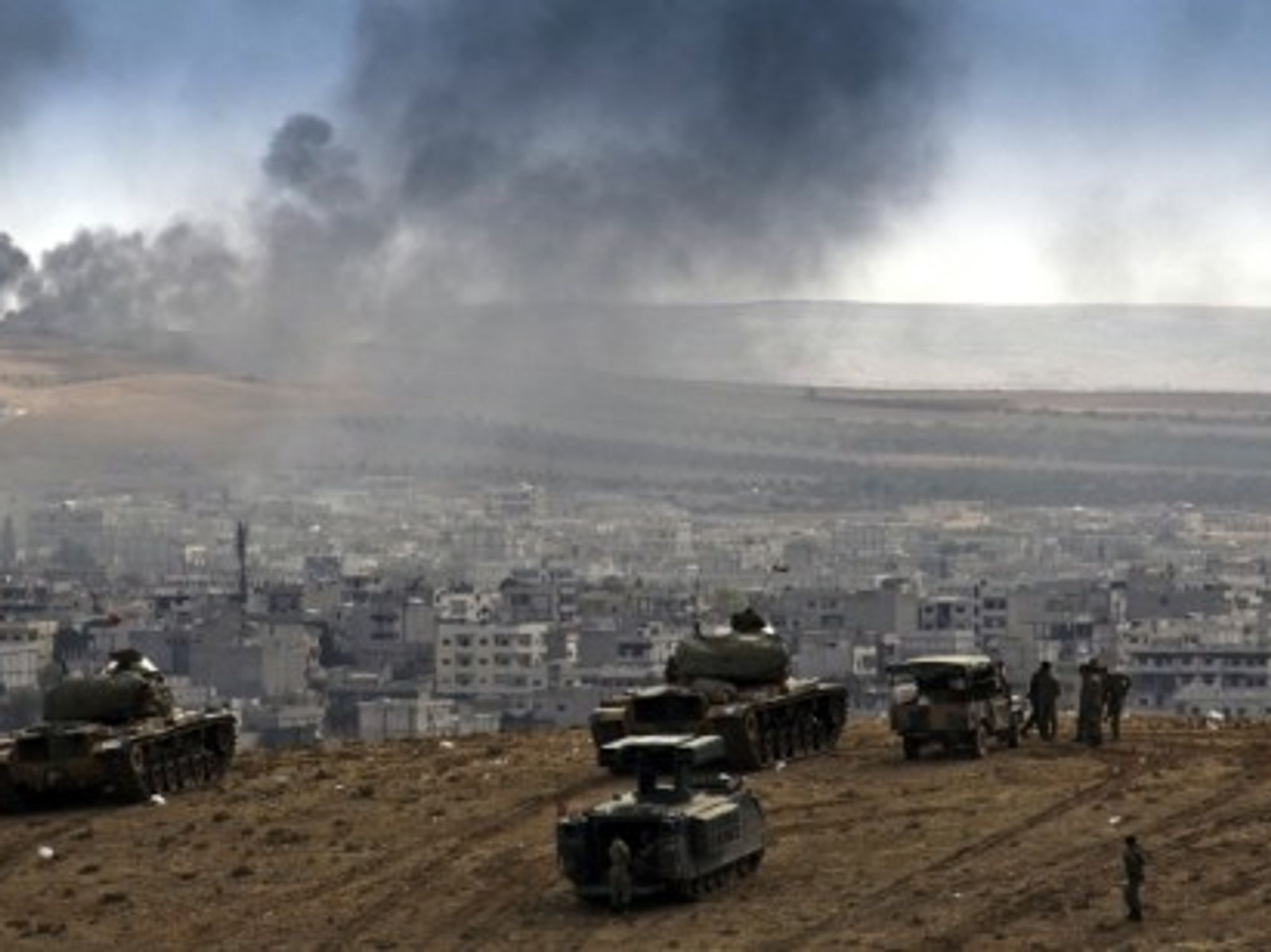 The Turkish military watches the battle in Kobane.
