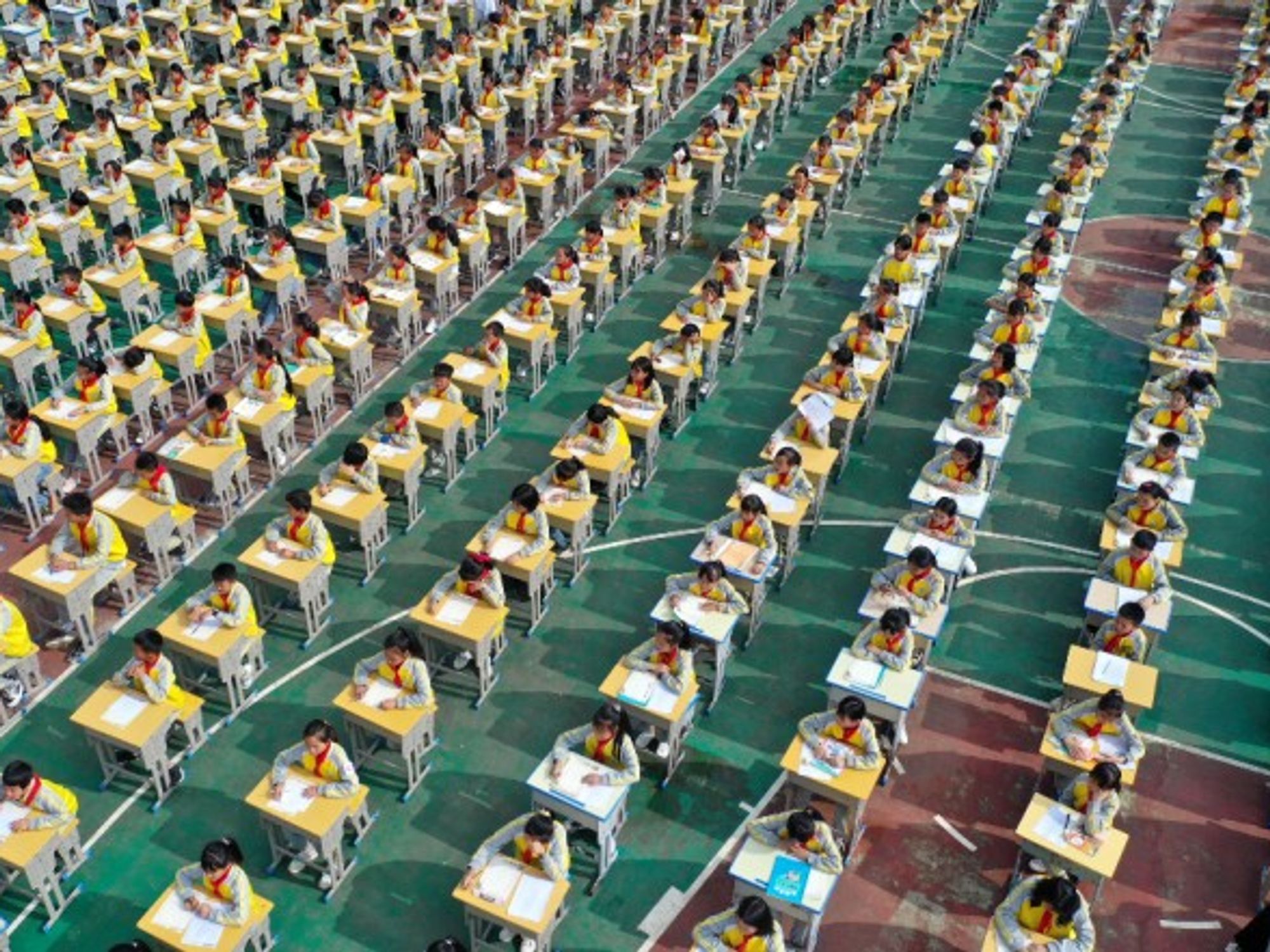 Thousands of schoolchildren participate in a calligraphy competition in Anlong, China