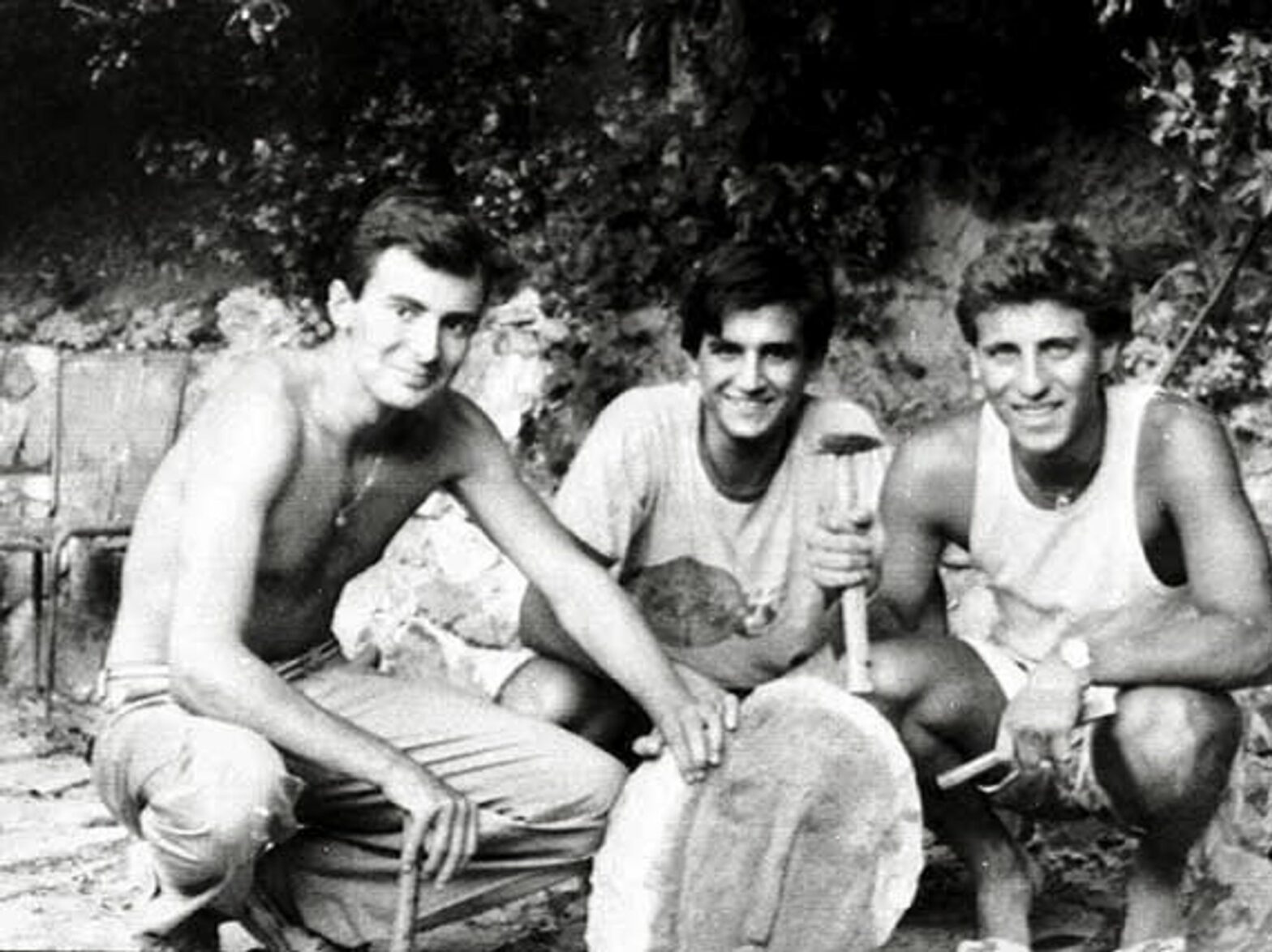 Three Italian college students posed with Modigliani's fake head and the tools with which they made it.