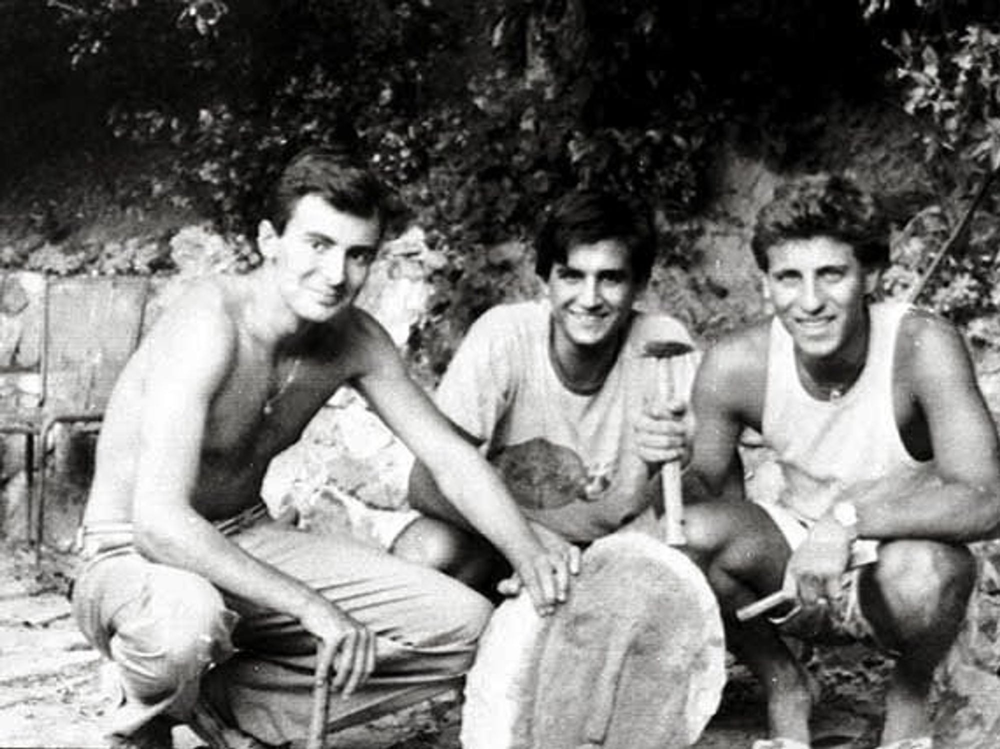 Three Italian college students posed with Modigliani's fake head and the tools with which they made it.