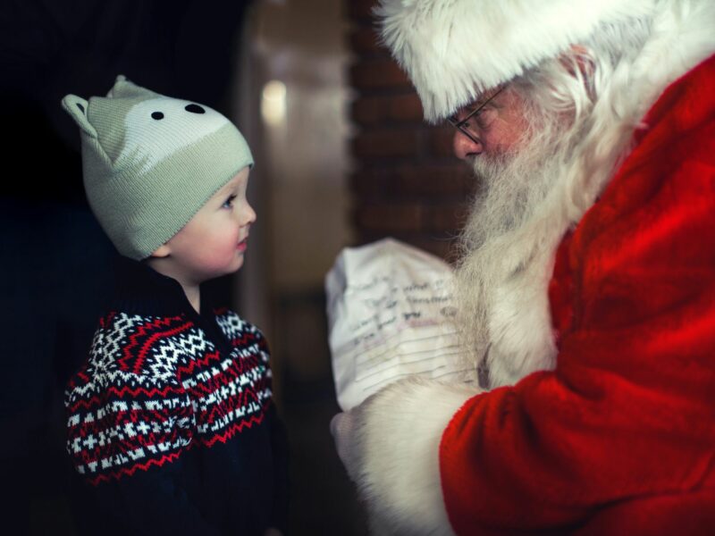 Toddler standing in front of Santa Claus, Oklahoma, United States, Dec. 11, 2016.