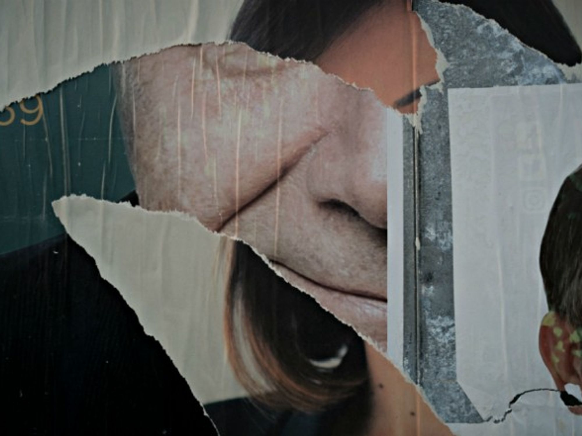 Torn election posters in Naples on March 2