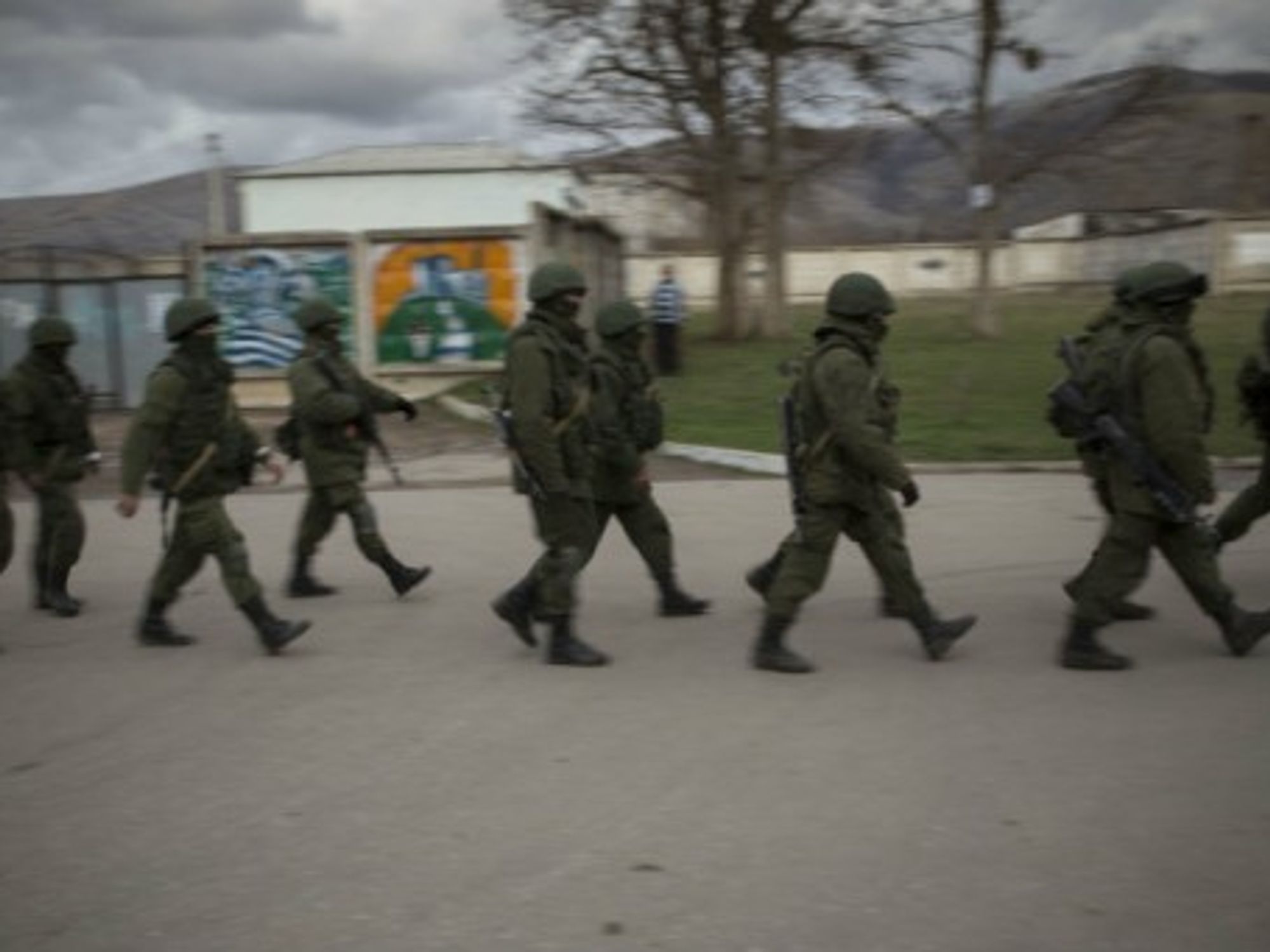 Troops believed to be from Russia on the march in Crimea.
