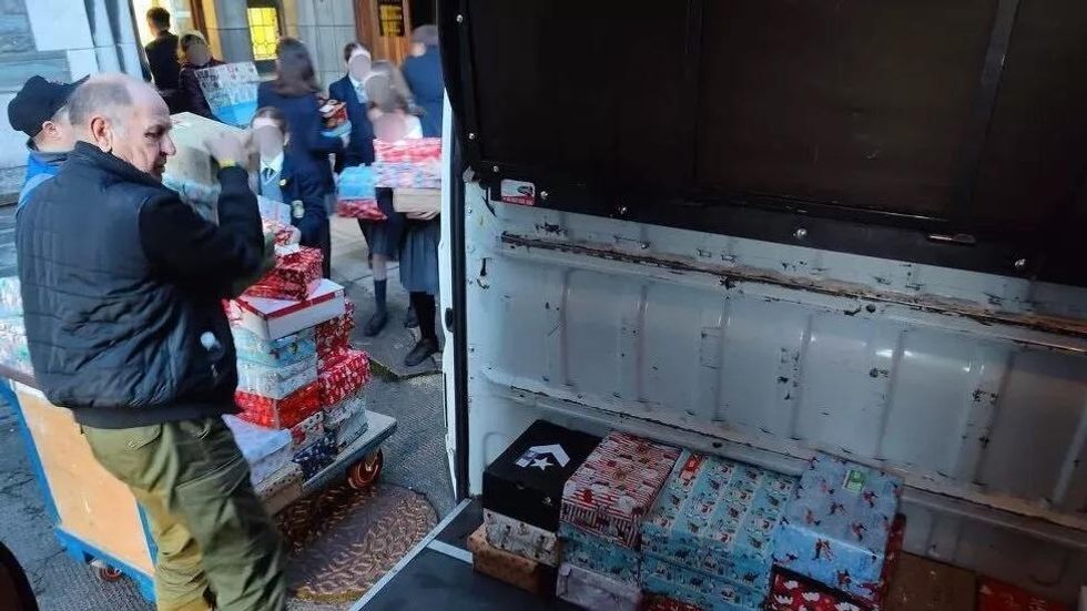 Truck is being loaded up with Christmas presents