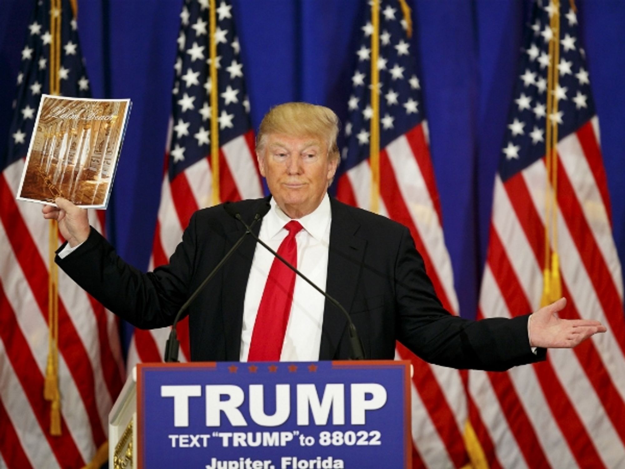 Trump holds the press in his hand...
