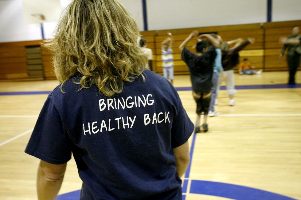 Turkey Creek Middle School (Florida) Physical Education teacher Tecca Kilmer, leads a line dance class in the schools gym.