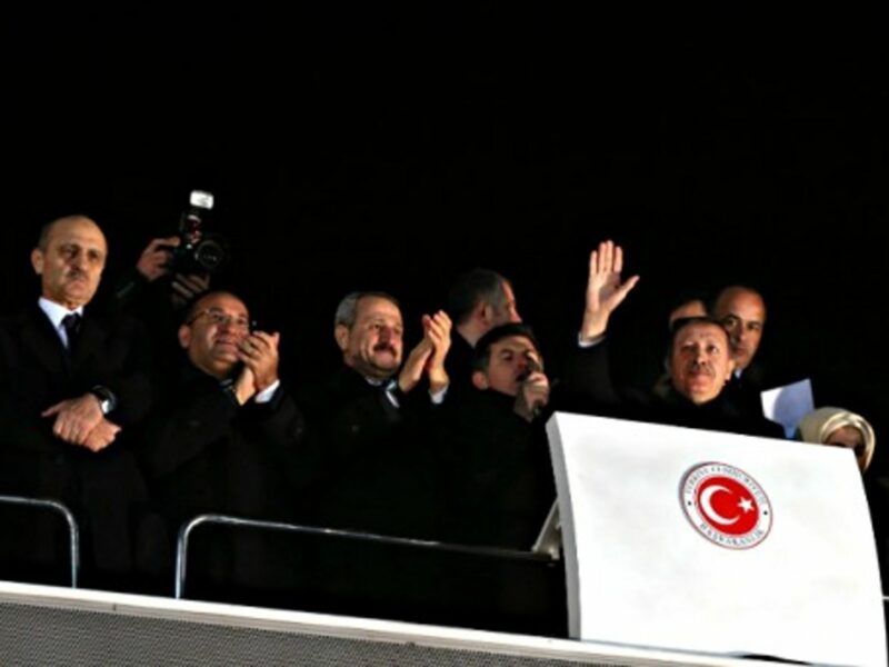 Turkish PM Recep Tayyip Erdogan (waving) and other AKP party members on Dec. 24