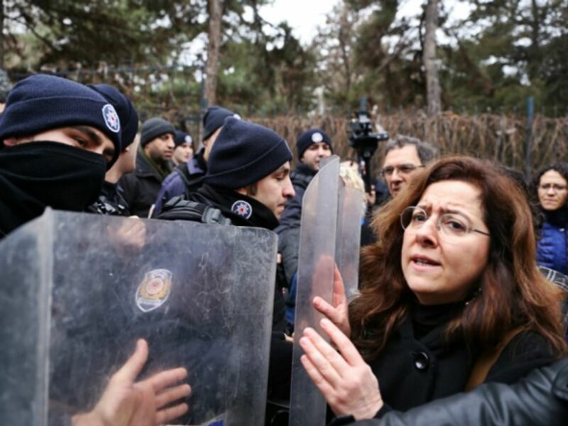 Turkish police restrain demonstrators on Feb. 10