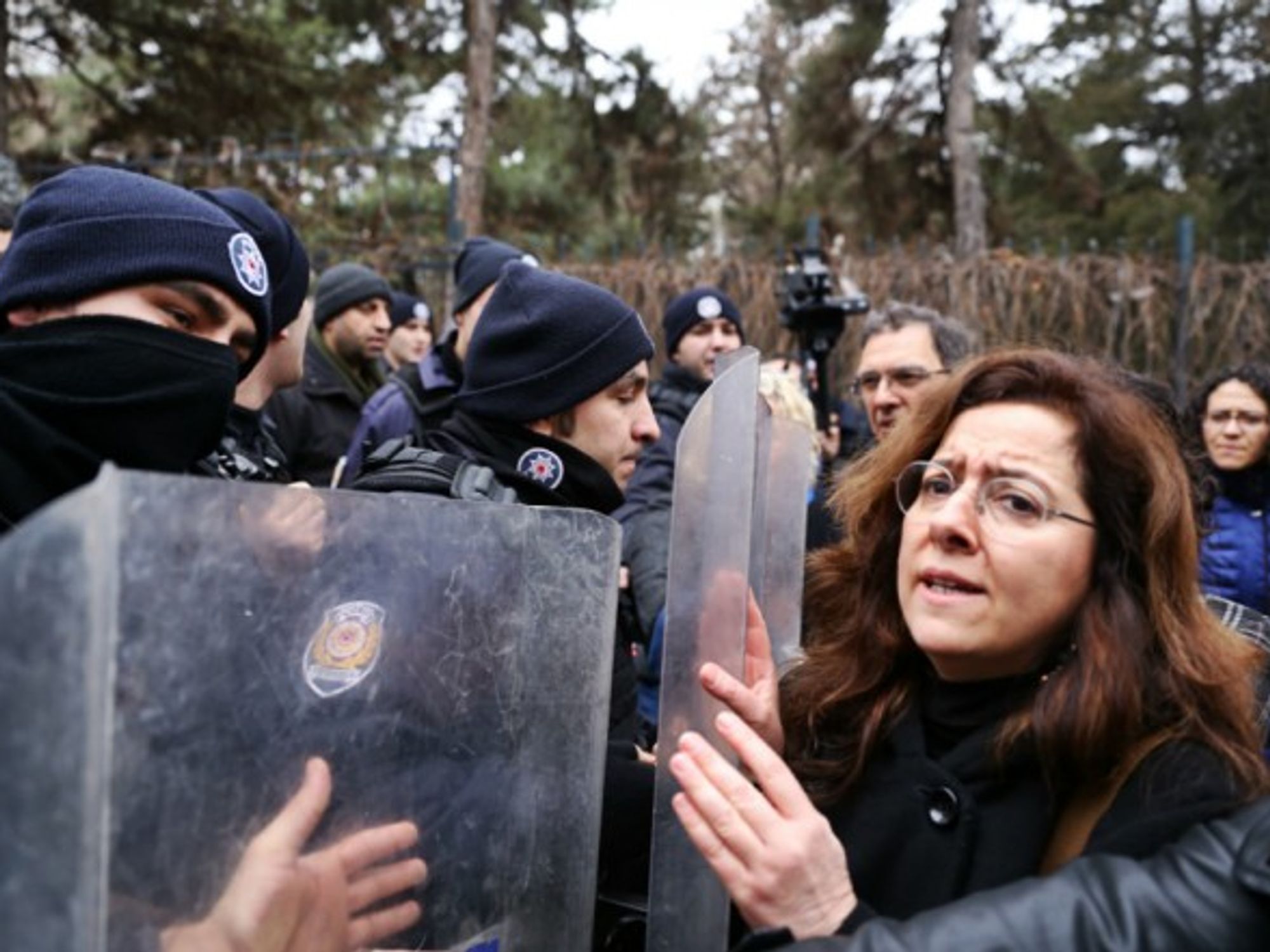 Turkish police restrain demonstrators on Feb. 10