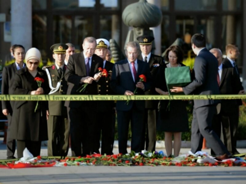 Turkish President Erdogan (2nd left) at a memorial in front of Ankara's train station