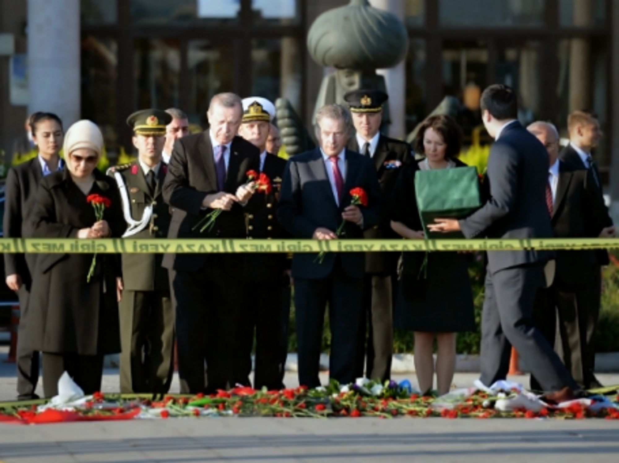Turkish President Erdogan (2nd left) at a memorial in front of Ankara's train station