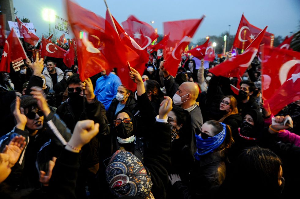 Turkish riot police use tear gas to disperse protesters gathering in front of the Aqueduct of Valens during a rally in support of Istanbul's arrested mayor in Istanbul Municipality on March 23, 2025 in Istanbul, Turkey