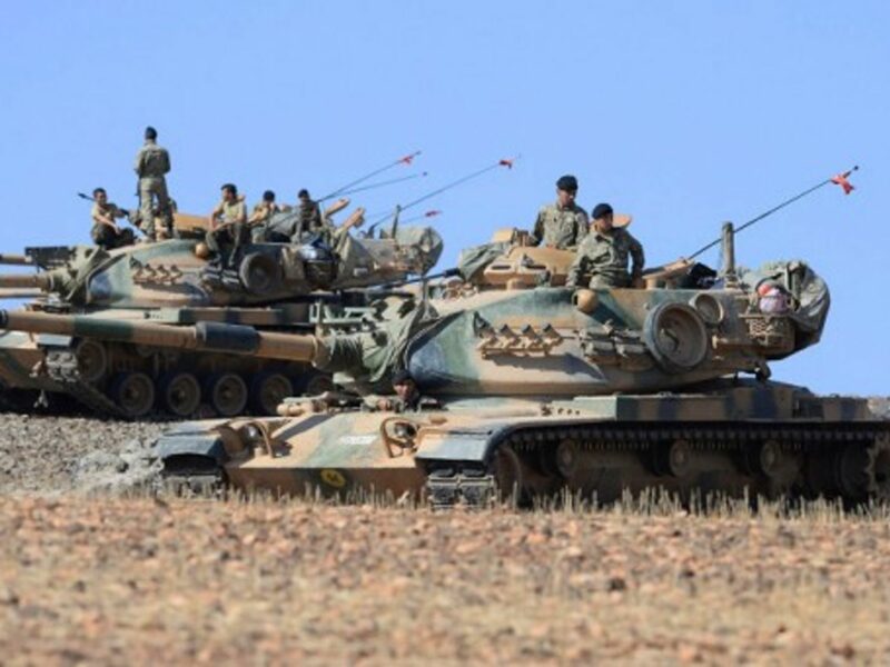Turkish tanks take up position on the Turkish - Syrian border at Suruc, Turkey.