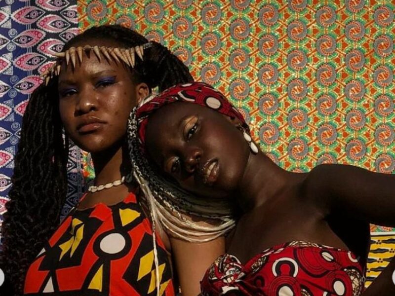 Two afrofeminism activists pausing together - The creative direction inspired by British-Moroccan photographer Hassan Hajjaj.