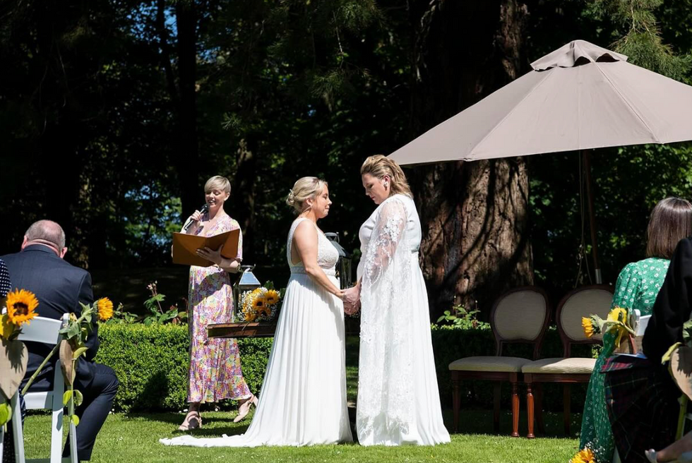 Two brides celebrating their wedding day.​