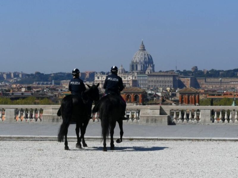 Two mounted police patrol Rome, Italy.
