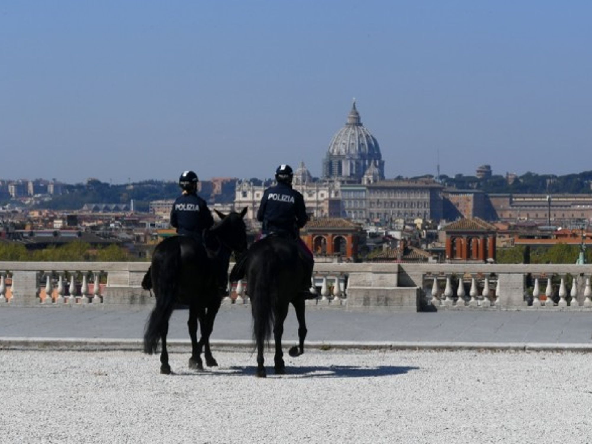 Two mounted police patrol Rome, Italy.