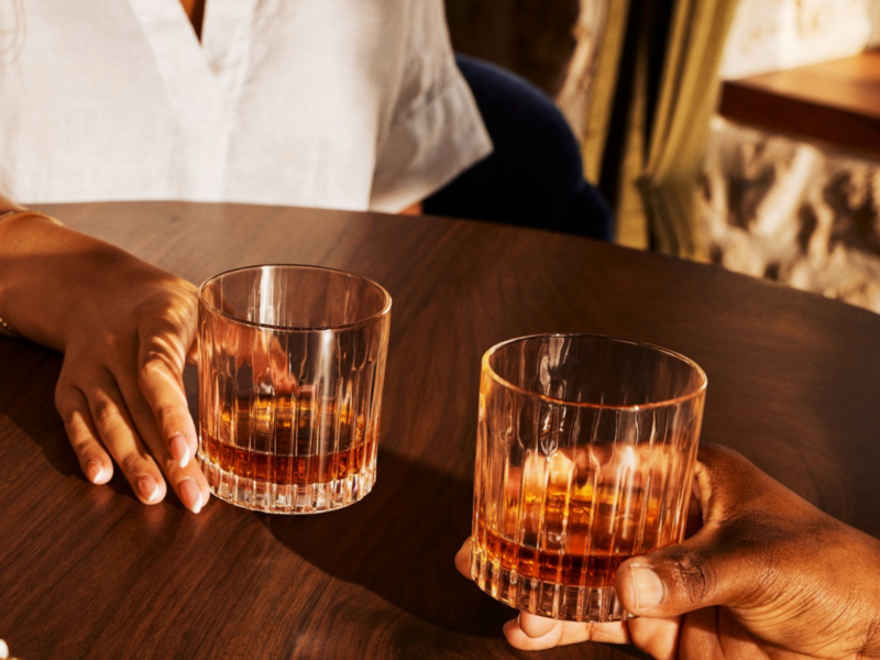 Two people enjoying their Mountgay rum
