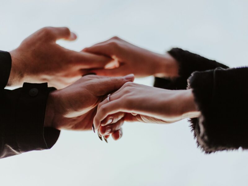 Two people holding hands