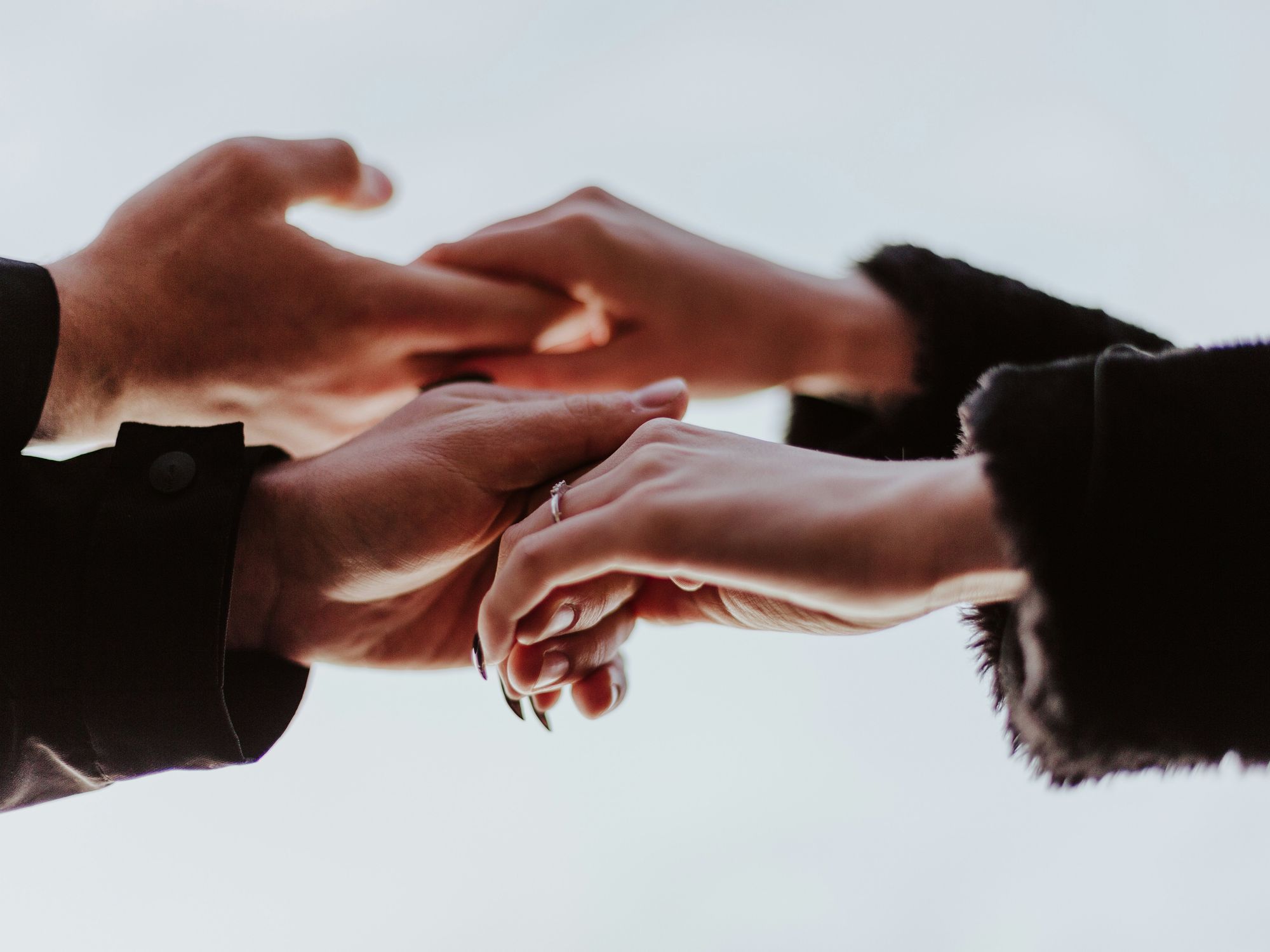 Two people holding hands