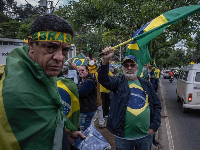 Two supporters of far-right Brazilian President Jair Bolsonaro dressed in Brazilian flags during a demonstration in Belo Horizonte, Brazil.
