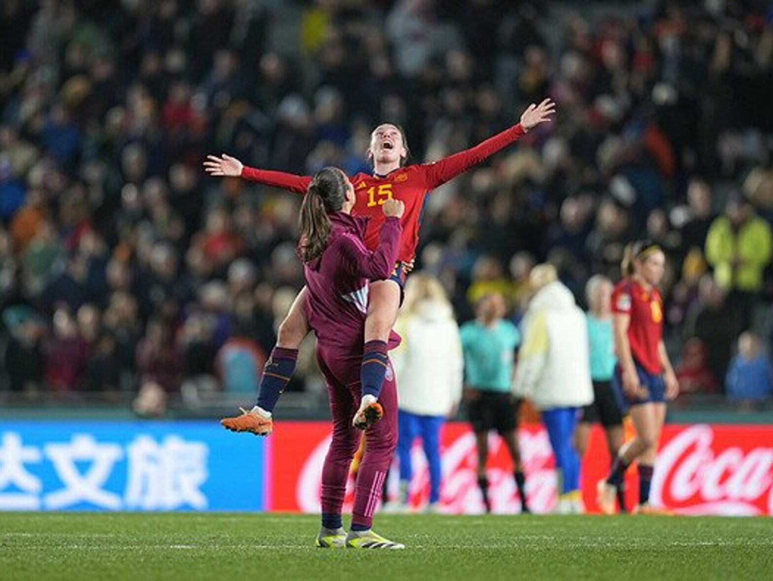 Two women soccer players celebrating.
