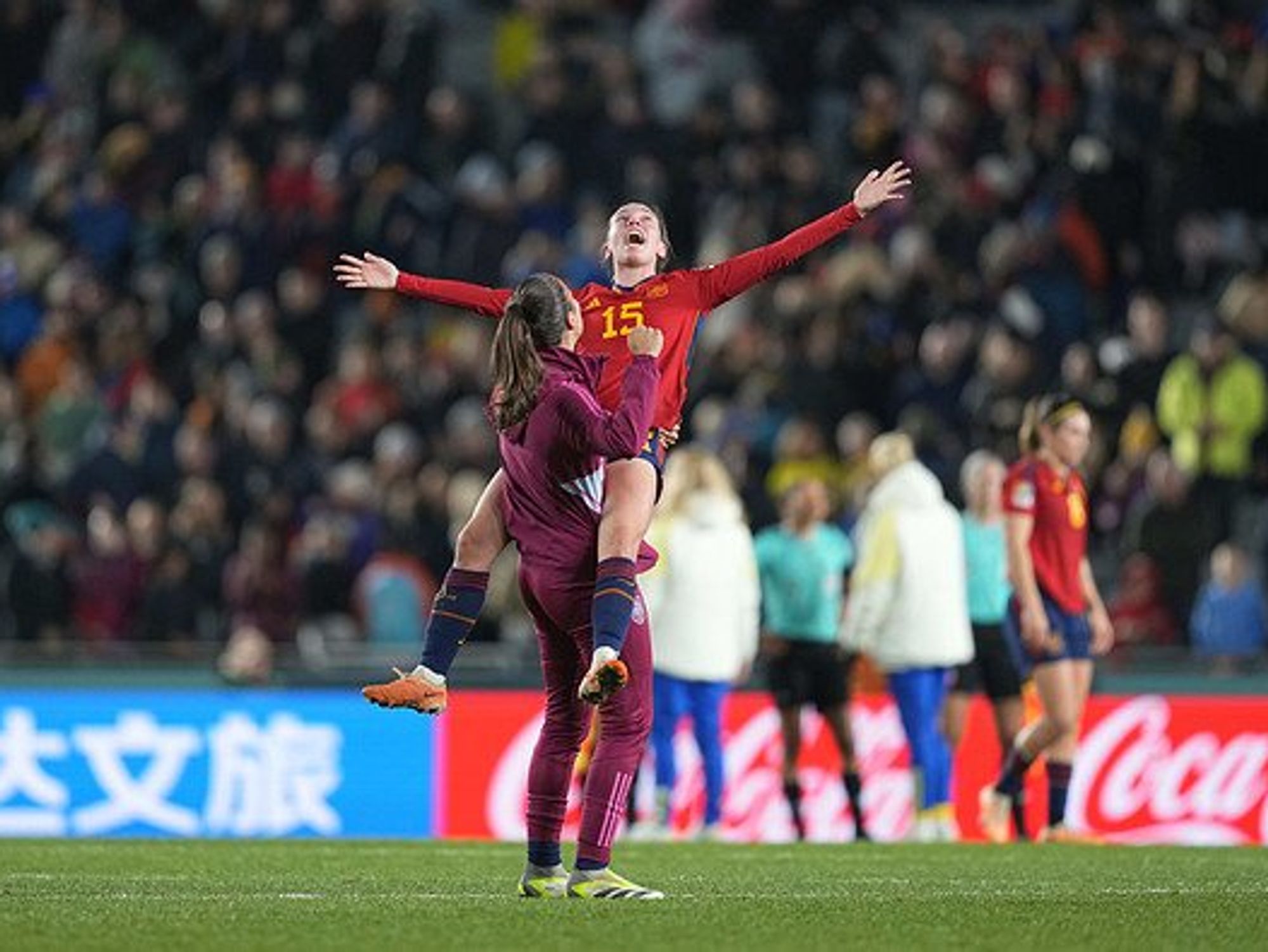 Two women soccer players celebrating.