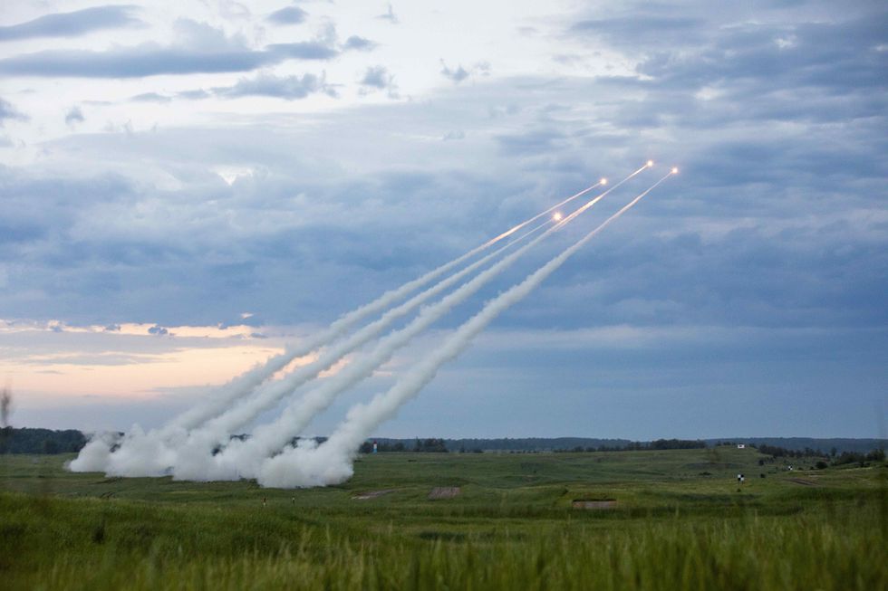 U.S. Army National Guard soldiers launching rockets during a live-fire training exercise at Camp Ripley, Minnesota