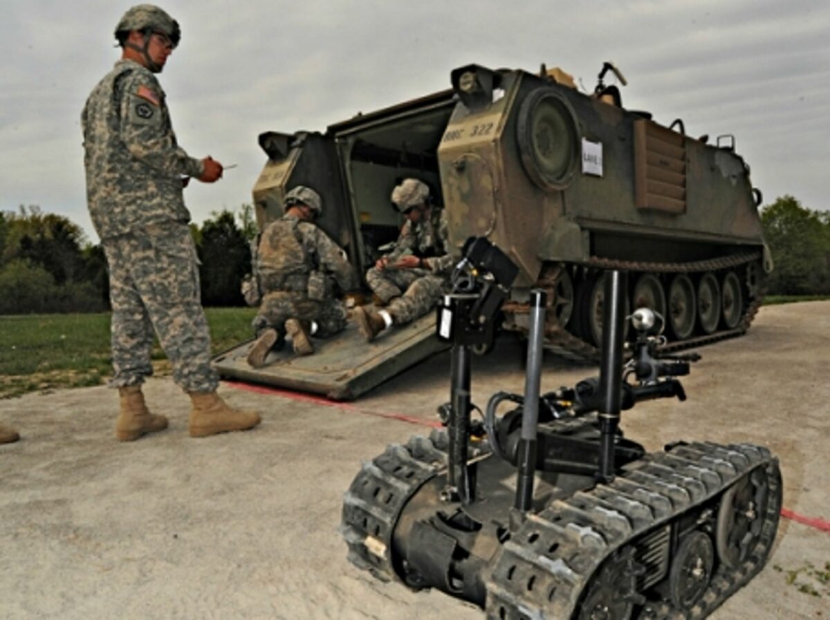 U.S. Army soldiers and a TALON robot, a military robot that is not (yet) autonomous